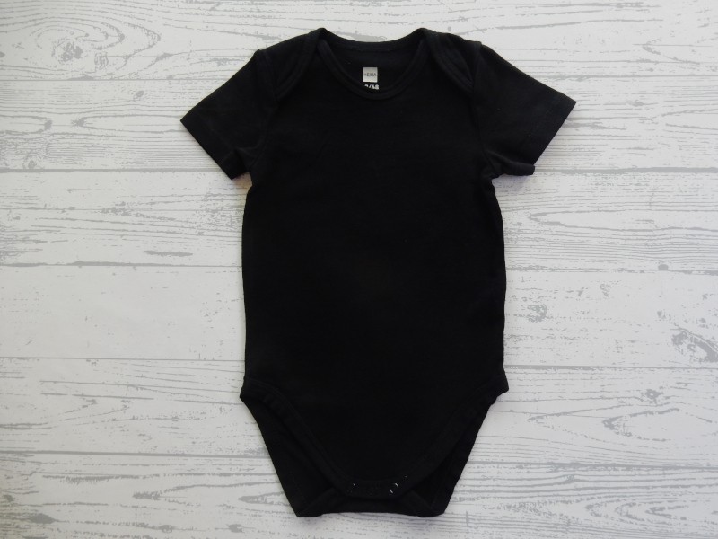 Hema romper korte mouw zwart wit maat 62-68