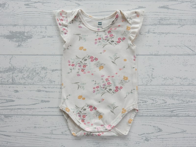 Hema romper zonder mouw ruches ecru groen roze bloemetjes maat 50-56