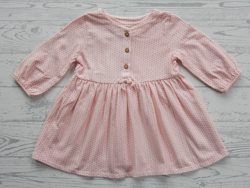 Next baby tricot jurkje wit zalmroze dessin maat 62