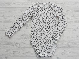 Hema romper lange mouw wit zwart animal print maat 98-104